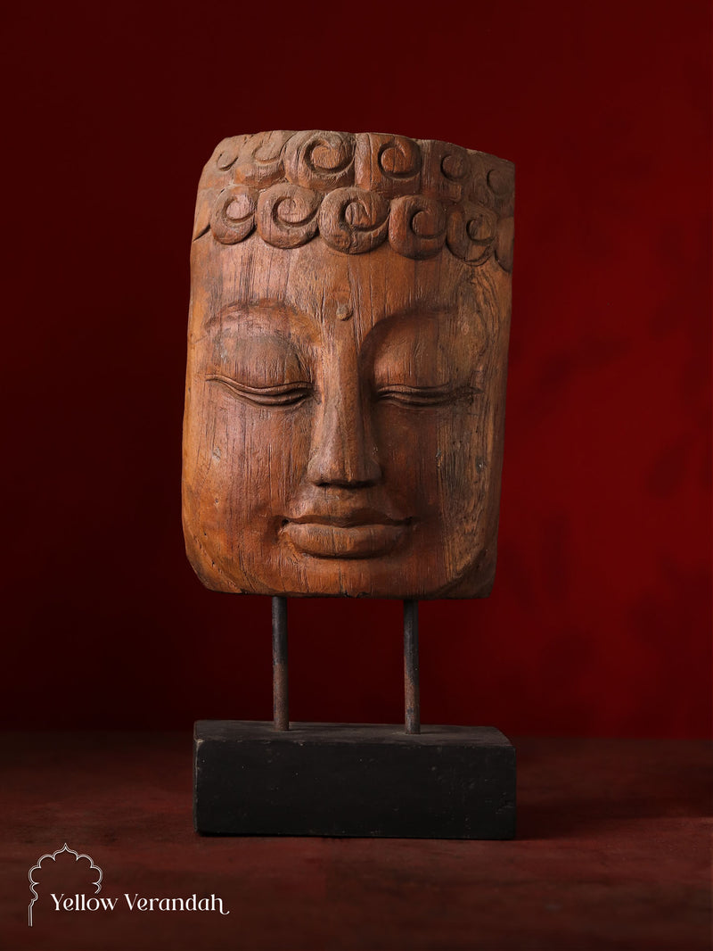 Antique Buddha on stand is a handmade art with wood carvings on it